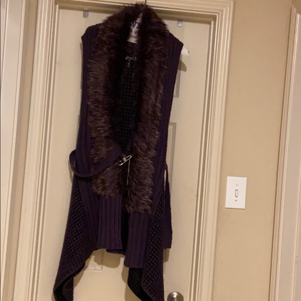 Sweater with fur collar. Pointed tail.